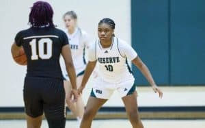 Energetic female basketball players in action during a game at Prep Athletics, showcasing skill, teamwork, and athletic training for youth sports development.