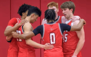 St. Paul’s basketball players in a pre-game huddle building team unity