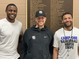 Tom Bower with two Kentucky shooters posing at Camp One basketball facility