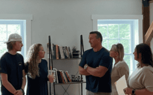 Chris Herren speaking with a small group at Herren Wellness about prevention and recovery strategies.