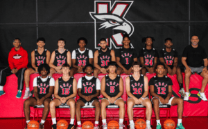 Knox School basketball team roster group photo in black uniforms with staff.