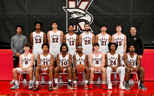 Knox School prep basketball team group photo in white uniforms with coaches