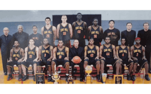 Oak Hill Academy basketball team group photo with coaches, players, and championship trophies