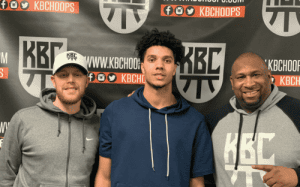 KBC basketball coaches with a student-athlete, supported to provide training, mentorship, and recruiting guidance.