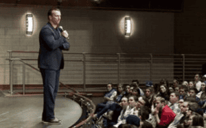 Chris Herren speaks to a packed auditorium of students about mental health, recovery, and early intervention in athletics.